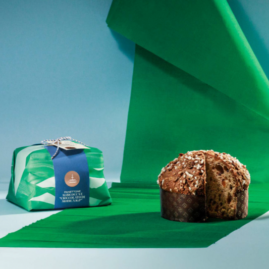 Panettone Candied Apricot & Modica Chocolate topped with Hazelnuts & Icing hand wrap. Available End November 2025